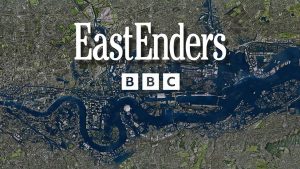 EastEnders opening title screen. White EastEnders text with BBC underneath. The Thames running through London sits underneath it.